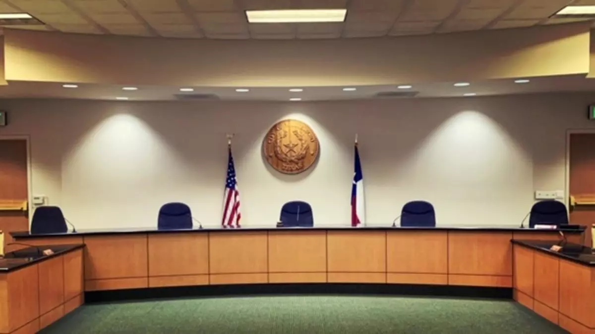 Whitesboro municipal courtroom behind judge bench is the great seal for the City of Whitesboro the American Flag and Texas Flag